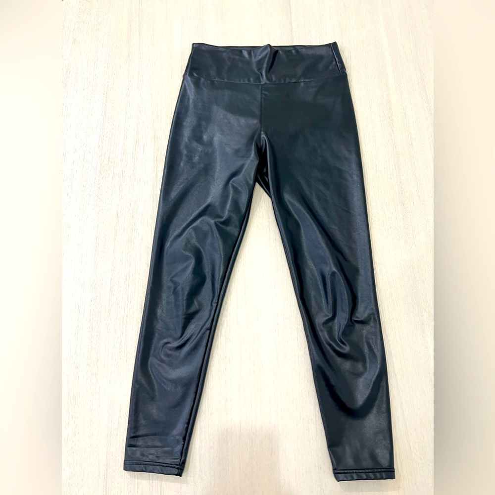 Black size medium pleather high waisted leggings. Mildly worn. Good material